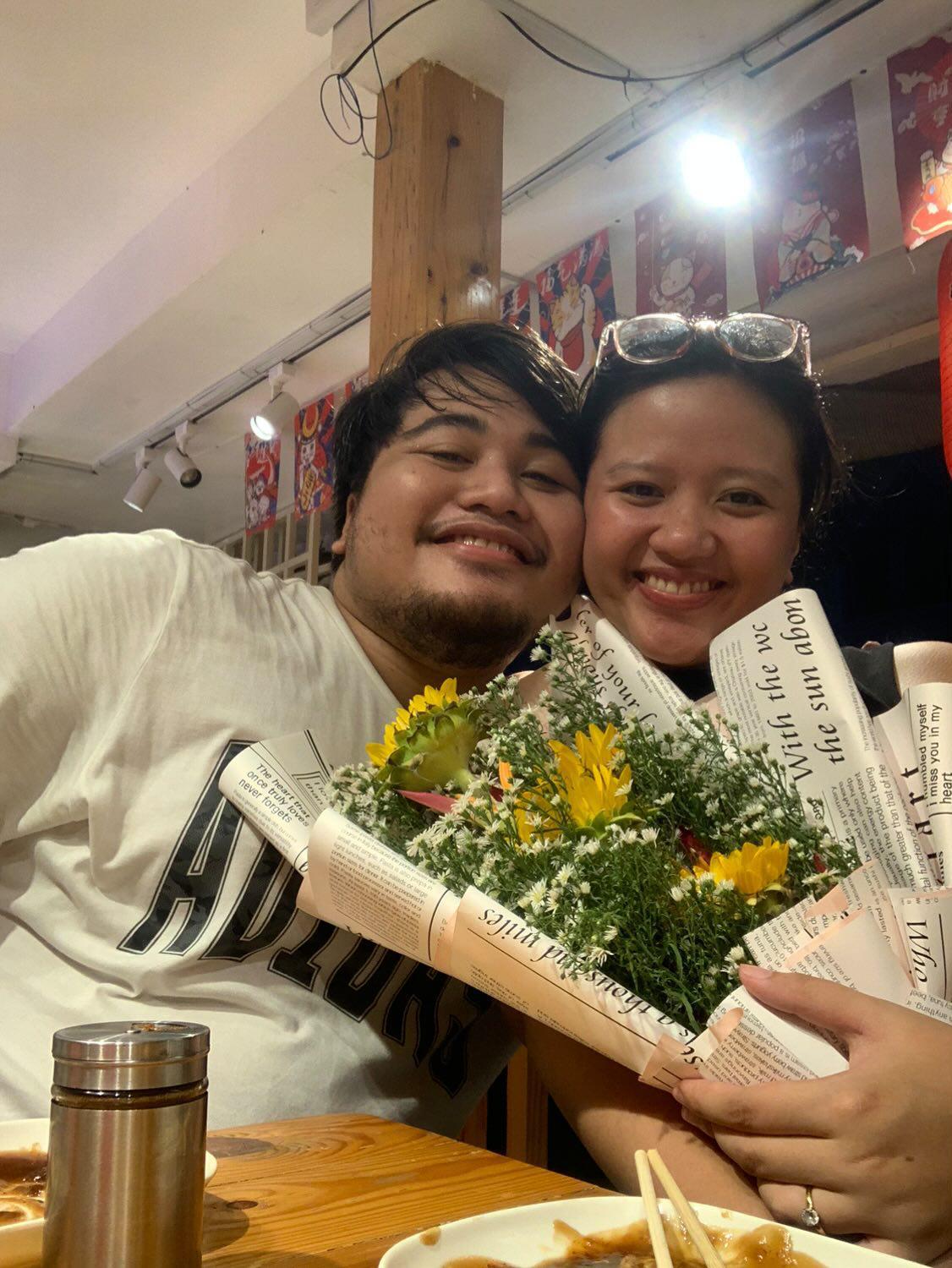 Jonas and Aliyah with flowers