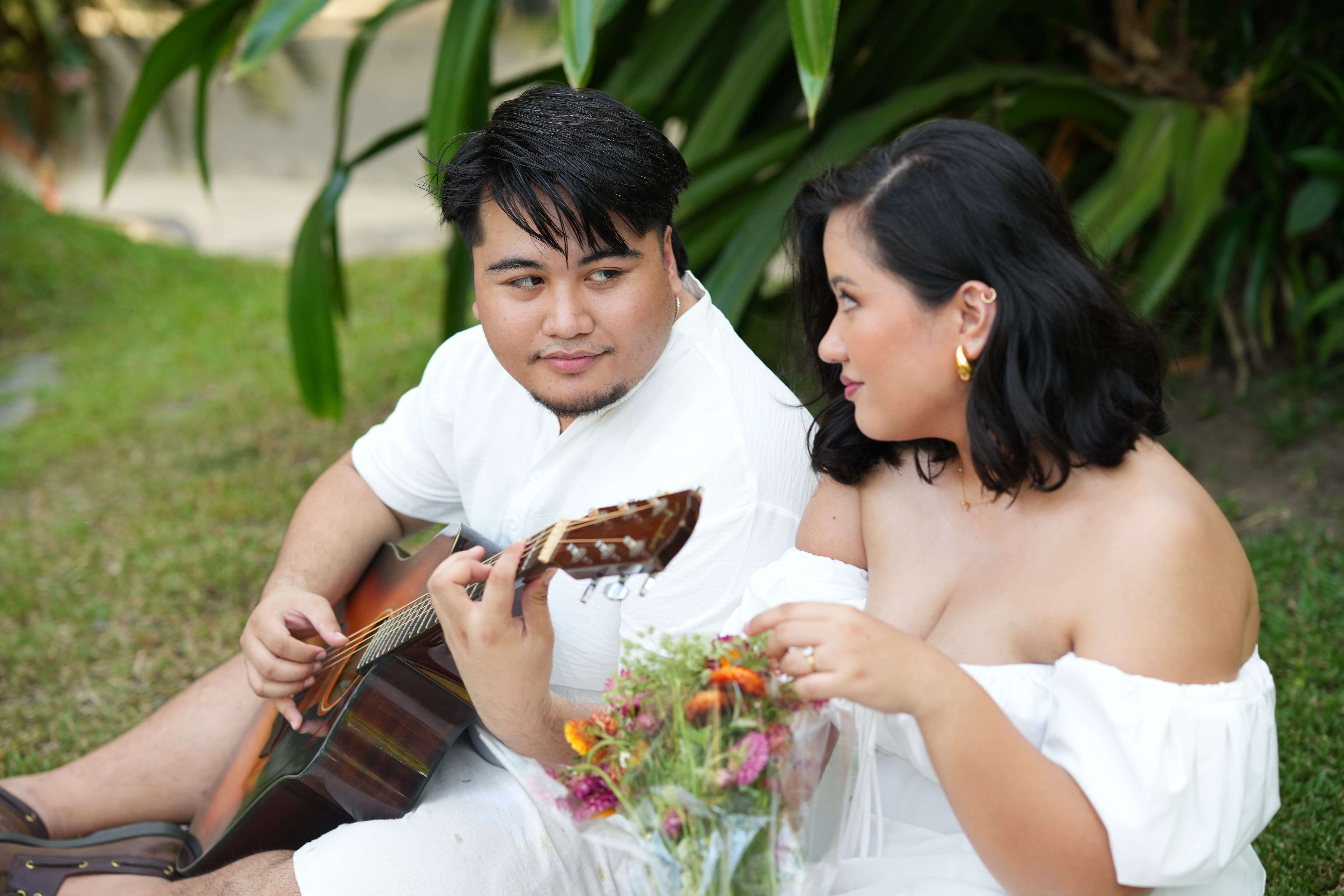 Jonas and Aliyah with a guitar